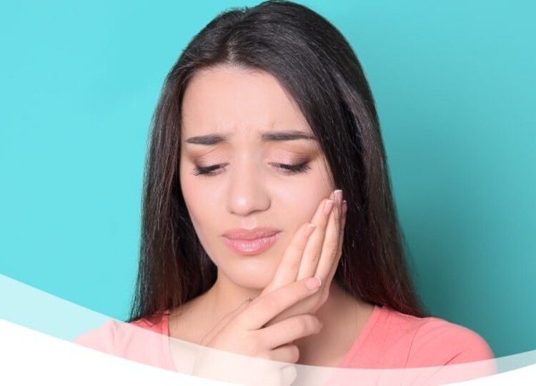 A real picture of a woman in need of pain relief medicine before root canal procedure