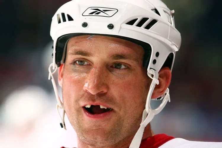 A picture of a famous hockey player with missing teeth